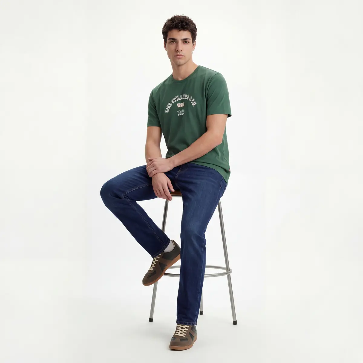 Green Cotton T-Shirt with Levi Strauss & Co. 1973 Graphic — Seated Stool Three Quarter Clasped